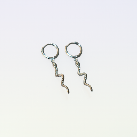 These sterling silver earrings feature a unique snake-shaped design. The earrings have a closed loop closure, allowing for secure and comfortable wear. The intricate, winding shape creates an eye-catching and distinctive accessory.