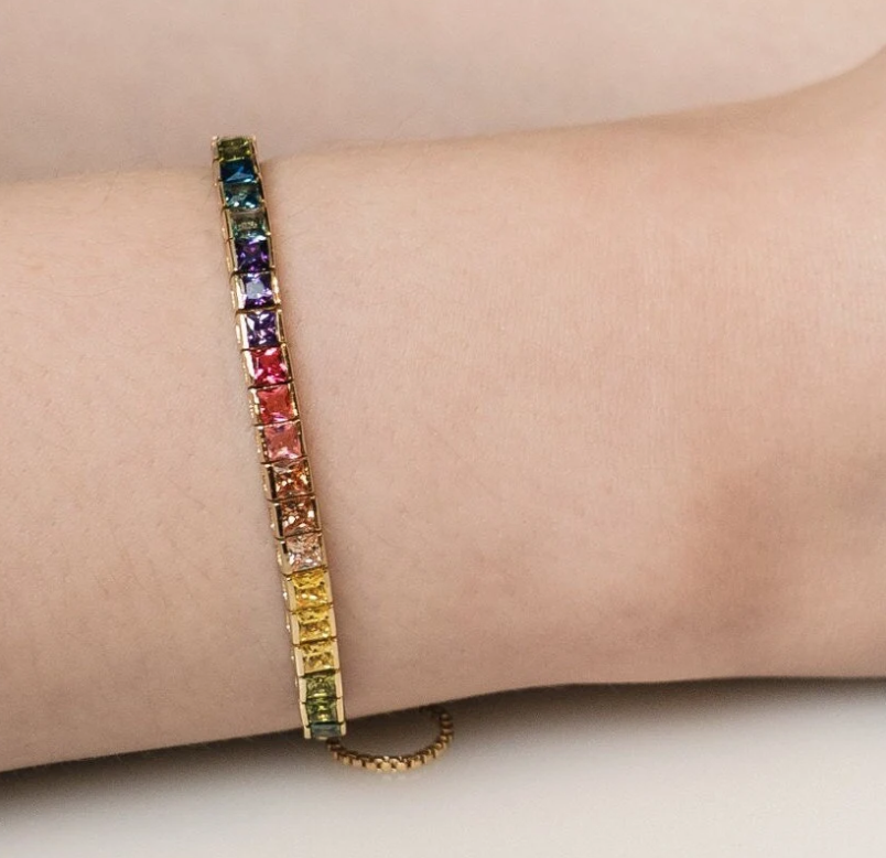 Celebrate diversity and love with this vibrant rainbow pride bracelet. A strand of colorful beads in every color of the rainbow - are strung together on a delicate gold chain.